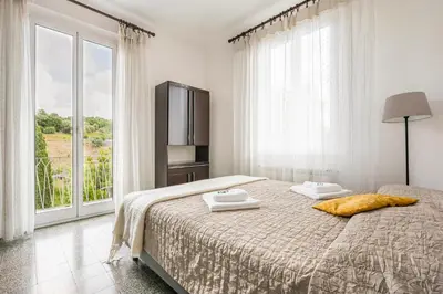 Letto o letti in una camera di GuestHost - Into the Green! Da Passano Apartment