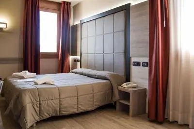 Letto o letti in una camera di Planet Hotel