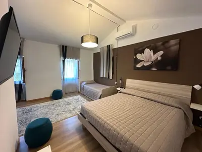 Letto o letti in una camera di B&B Ronco Oste