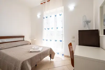 Letto o letti in una camera di GuestHost - Casa Nameste 5Terre Holiday Apartment