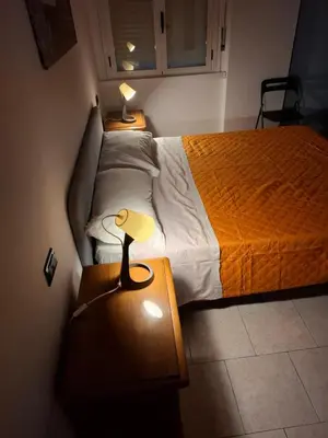 Letto o letti in una camera di FARE BnB - Room Porta Castello