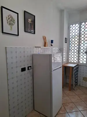 Cucina o angolo cottura di FARE BnB - Room Porta Castello