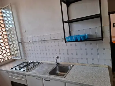 Cucina o angolo cottura di FARE BnB - Room Porta Castello