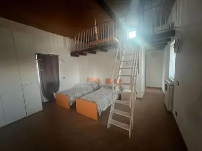 Letto o letti in una camera di Nido nel verde