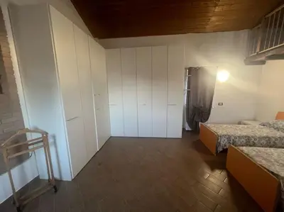 Letto o letti in una camera di Nido nel verde
