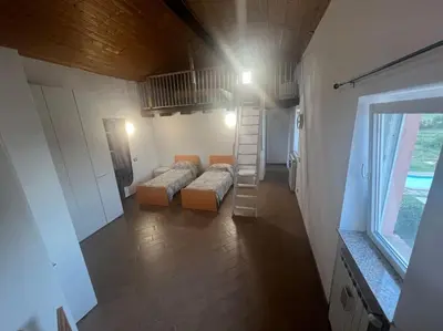 Letto o letti in una camera di Nido nel verde