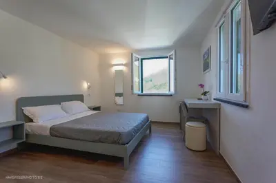 Letto o letti in una camera di Affittacamere MontAle