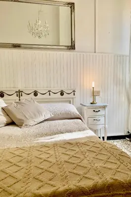 Letto o letti in una camera di Casa Adele