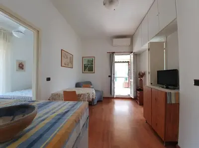 Letto o letti in una camera di Casa Luisa - MONEGLIA APARTMENTS