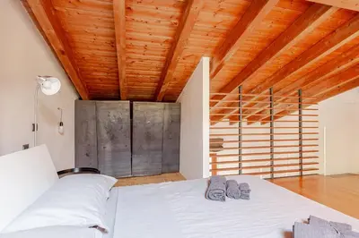 Letto o letti in una camera di Piacenza Open Space