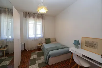 Letto o letti in una camera di Modena - vicino al centro - Free Parking & Wi-Fi