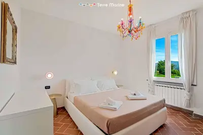 Letto o letti in una camera di Villa Effe, Terre Marine