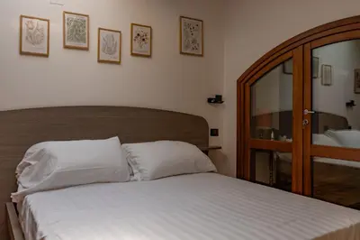 Letto o letti in una camera di B&B Villa Argiolas