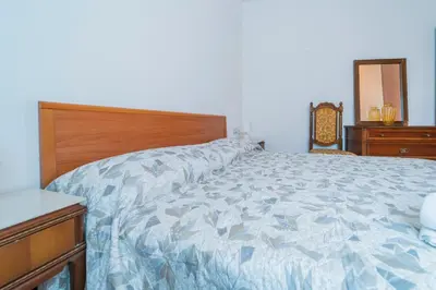 Letto o letti in una camera di 139b - Casa Santa Vittoria, 10 minuti dal mare e spiaggia di Sestri Levante