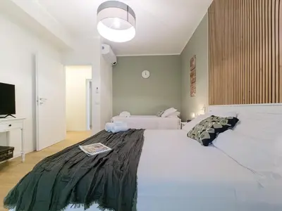 Letto o letti in una camera di Motor Valley Boutique Apartment - 3 Suites