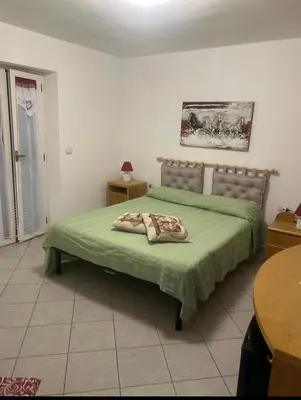 Letto o letti in una camera di Ca' Martina