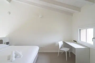 Letto o letti in una camera di Nour Apartments - La Corte del Re