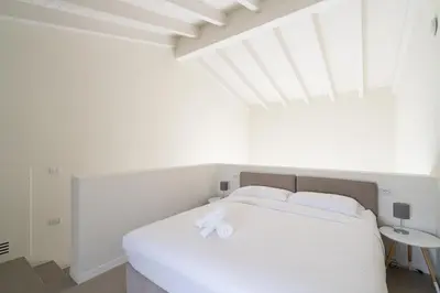 Letto o letti in una camera di Nour Apartments - La Corte del Re