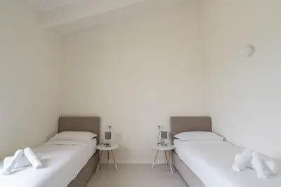 Letto o letti in una camera di Nour Apartments - La Corte del Re