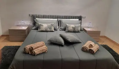 Letto o letti in una camera di Appartamento IL GIGLIO
