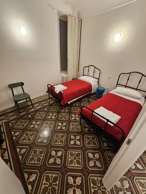 Letto o letti in una camera di Casa Via Poggiali