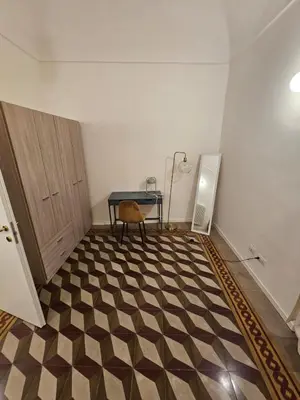 Letto o letti in una camera di Casa Via Poggiali