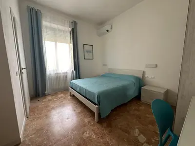 Letto o letti in una camera di Le Terre del Golfo Rooms