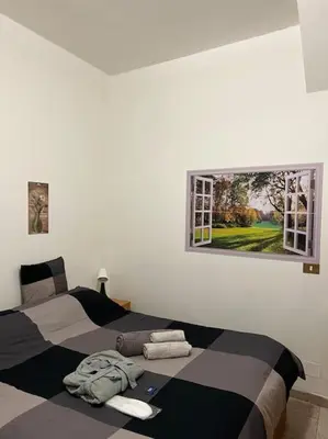 Letto o letti in una camera di La tana moderna