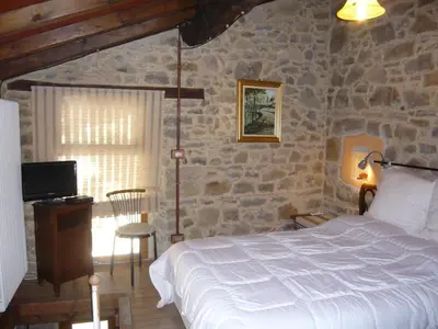 Letto o letti in una camera di Agriturismo Petrarosa