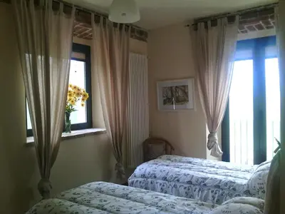 Letto o letti in una camera di Agriturismo Petrarosa