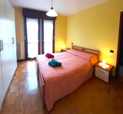 Letto o letti in una camera di Confortevole appartamento a Reggio Emilia