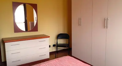 Letto o letti in una camera di Confortevole appartamento a Reggio Emilia