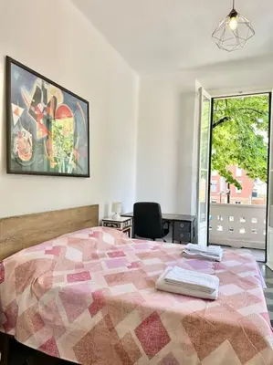 Letto o letti in una camera di Appartamento liberty Vittoria