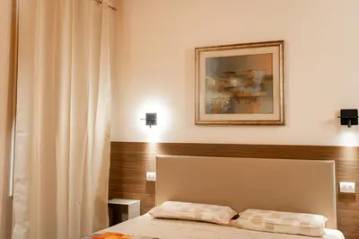 Letto o letti in una camera di Villa Eliseo