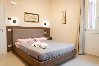 Letto o letti in una camera di Villa Eliseo
