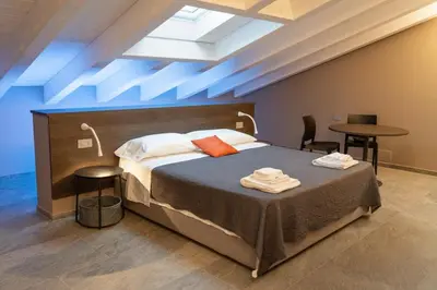 Letto o letti in una camera di Villa Eliseo