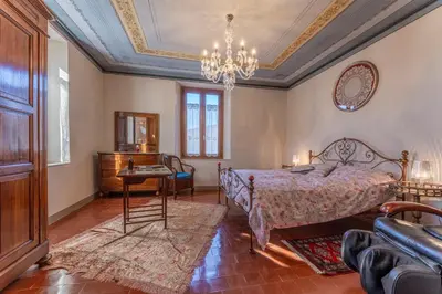 Letto o letti in una camera di Orazio Liberty House,Lunigiana, Nature