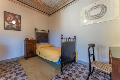 Letto o letti in una camera di Orazio Liberty House,Lunigiana, Nature