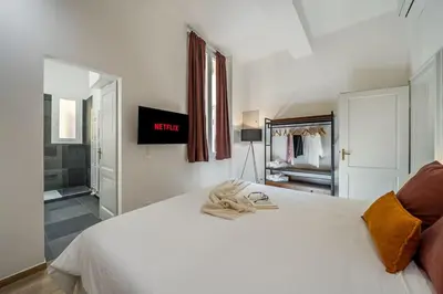 Letto o letti in una camera di Lussuoso appartamento con vista Ghirlandina