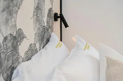Letto o letti in una camera di Palazzo Garibaldi Parma Luxury Rooms & Suites