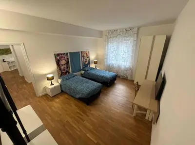 Letto o letti in una camera di Appartamento spazioso in centro
