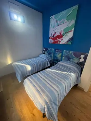 Letto o letti in una camera di Rooms Of Love
