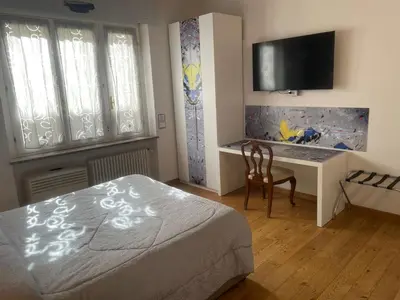 Letto o letti in una camera di Rooms Of Love