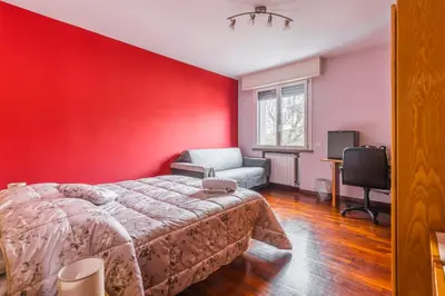Letto o letti in una camera di Suite con Bagno a Carpi Wi-Fi & Smart tv