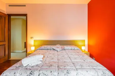 Letto o letti in una camera di Suite con Bagno a Carpi Wi-Fi & Smart tv