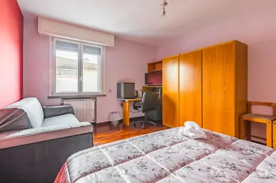 Letto o letti in una camera di Suite con Bagno a Carpi Wi-Fi & Smart tv