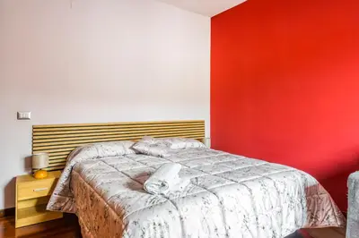 Letto o letti in una camera di Suite con Bagno a Carpi Wi-Fi & Smart tv