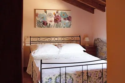 Letto o letti in una camera di Pretola