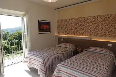 Letto o letti in una camera di La Foresteria della Beppa
