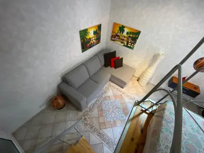 Area soggiorno di Appartamento centro storico davanti al Duomo di Pavia